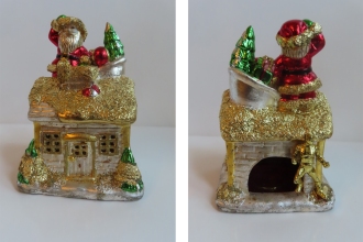 Weihnachtshäuschen 2025, Keramik buntes Blattmetall, , Plastik Figur Black Adam Atom Smasher,   Schlagmetall vergoldet, Höhe 14 cm